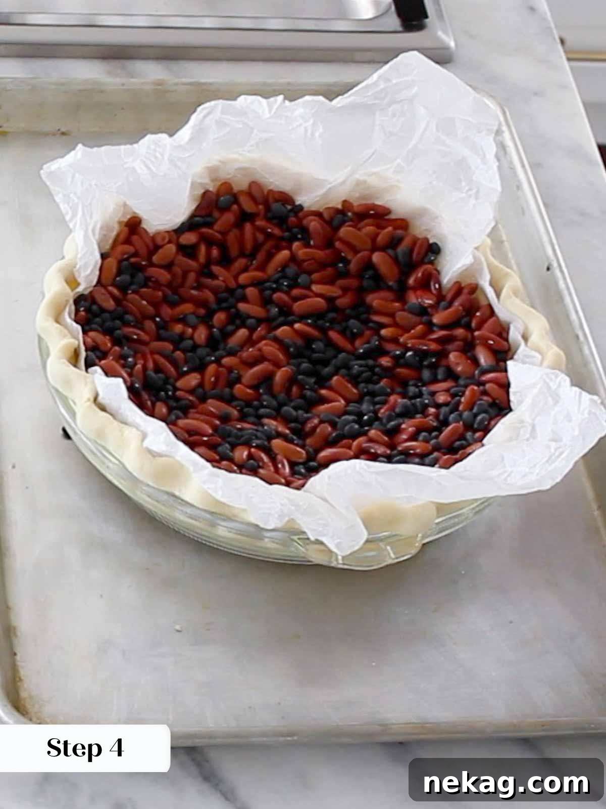 Decadent Pecan Pie Perfection 7 Blind baking pie crust using dried beans as pie weights to prevent bubbling and shrinkage.
