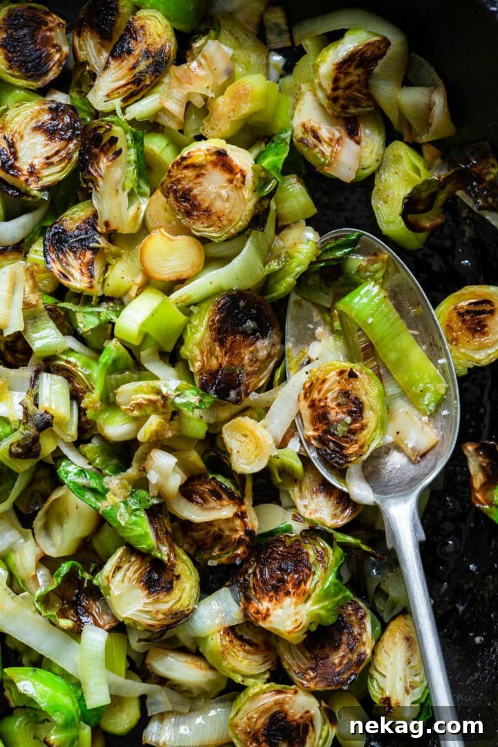 Zesty Lime-Ginger Buttered Brussels Sprouts and Leeks 7 Close-up of Brussels Sprouts and Leeks with Lime-Ginger Butter on a Spoon