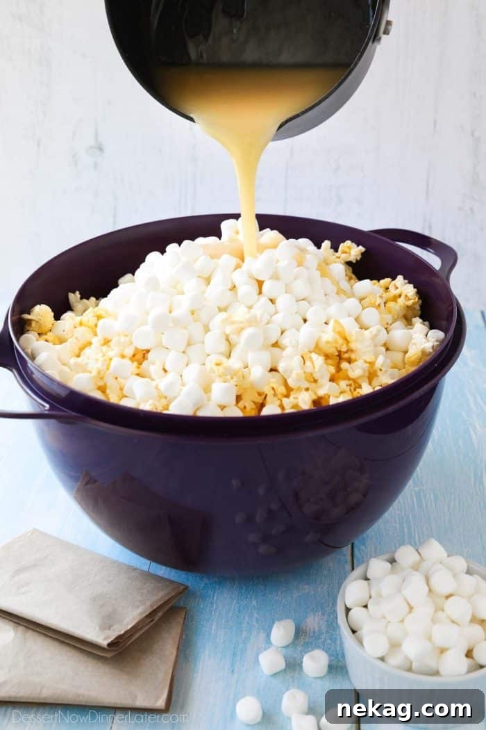 Pouring the hot buttery syrup mixture over the popcorn will melt the mini marshmallows to create a soft and gooey marshmallow popcorn treat.
