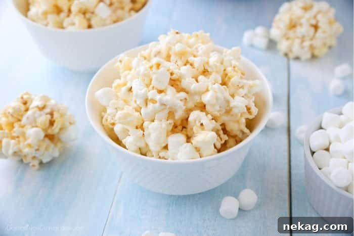 Marshmallow Popcorn is an easy and cheap snack that feeds a crowd! Perfect for movie night!