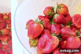 Strawberries being spun dry in a salad spinner