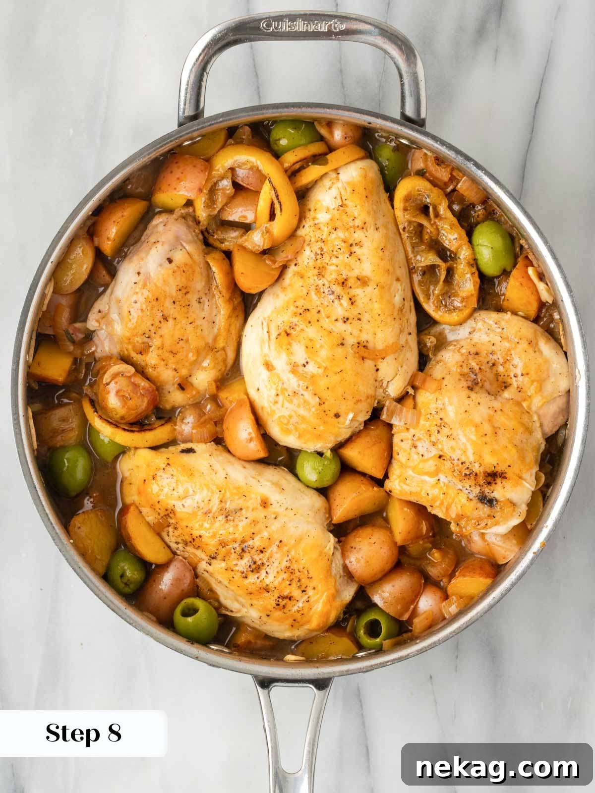 Completed lemon chicken and potatoes in the pan, ready to be served.