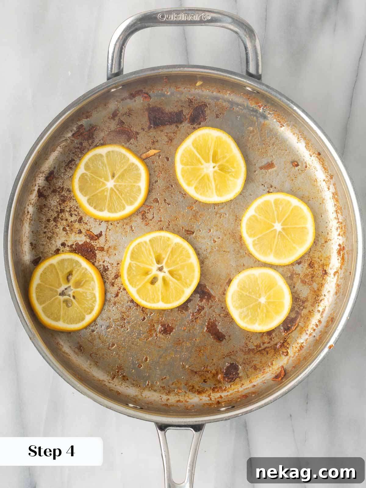 Thin lemon slices searing in a pan.