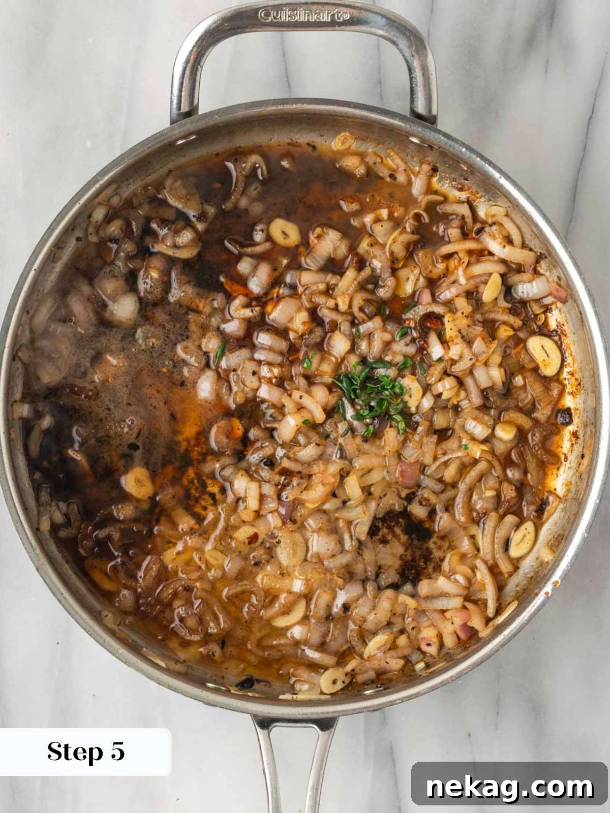 Shallots and garlic cooking in a pan, creating an aromatic base.