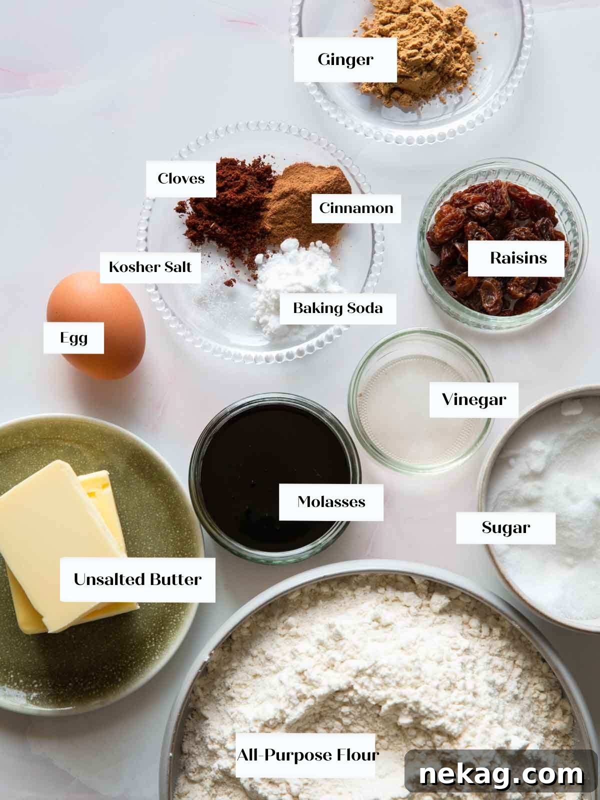 A beautiful arrangement of fresh ingredients on a white surface, prepared for making homemade gingerbread cookies.