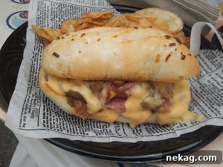 My Disney Magic Revealed 8 Gourmet roast beef sandwich with saucy cheese, caramelized onions, and horseradish on a toasted onion roll
