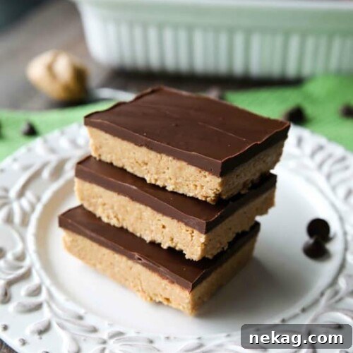 A stack of Easy No-Bake Peanut Butter Bars with chocolate topping