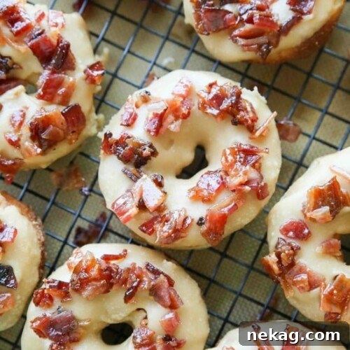 Candied Bacon Maple Donuts 2 Maple Bacon Donuts are breakfast perfection! The salty bacon cuts through the sweetness of the maple and brown sugar glaze on top of a fluffy yeast donut.