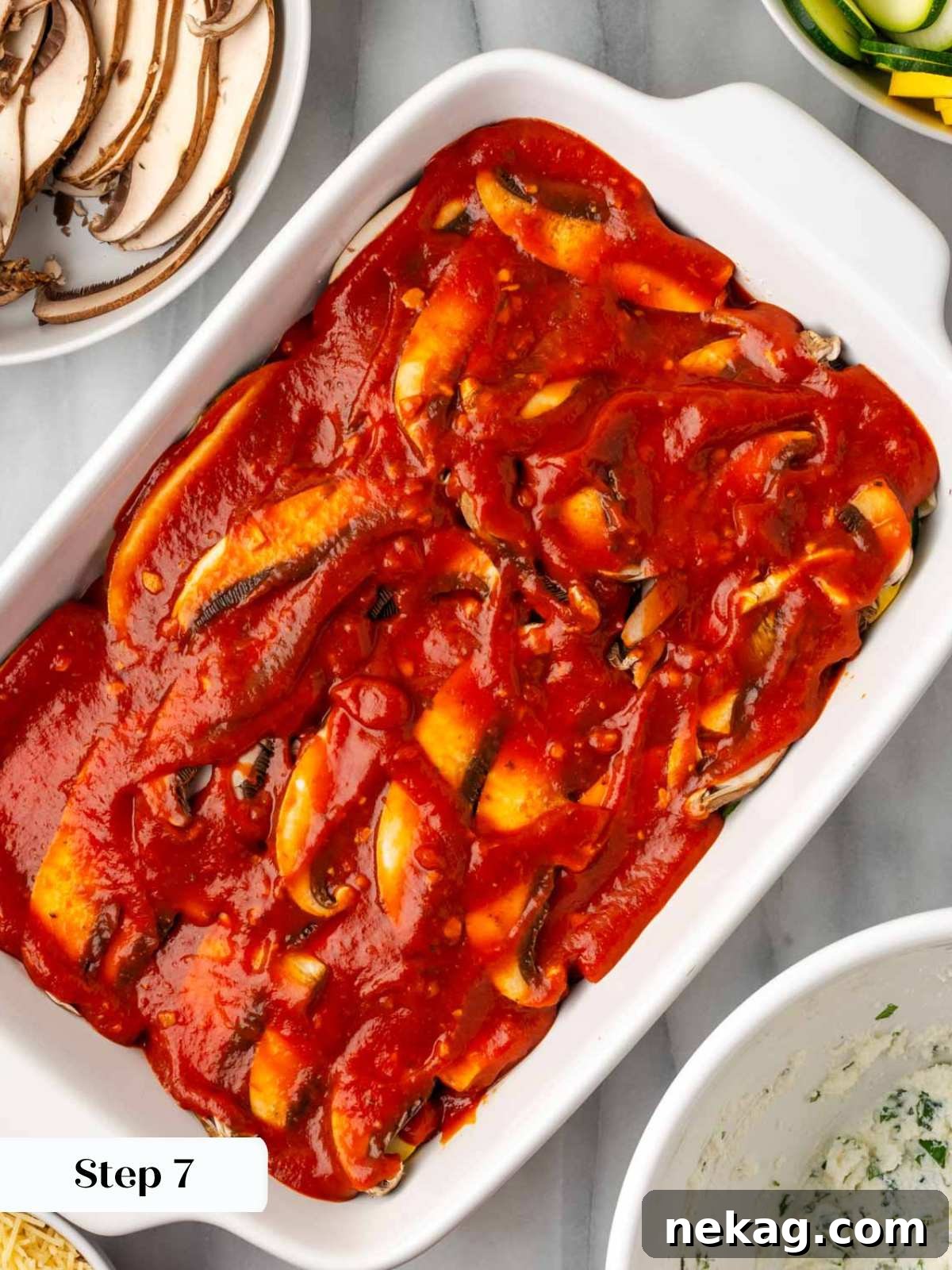 Seasonal Vegetable Lasagna 11 Pouring tomato pasta sauce over the layered vegetables in the lasagna dish.