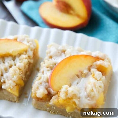 Delicious Peach Crumb Bars, a perfect summer dessert with fresh peaches, buttery crust, and a sweet glaze.