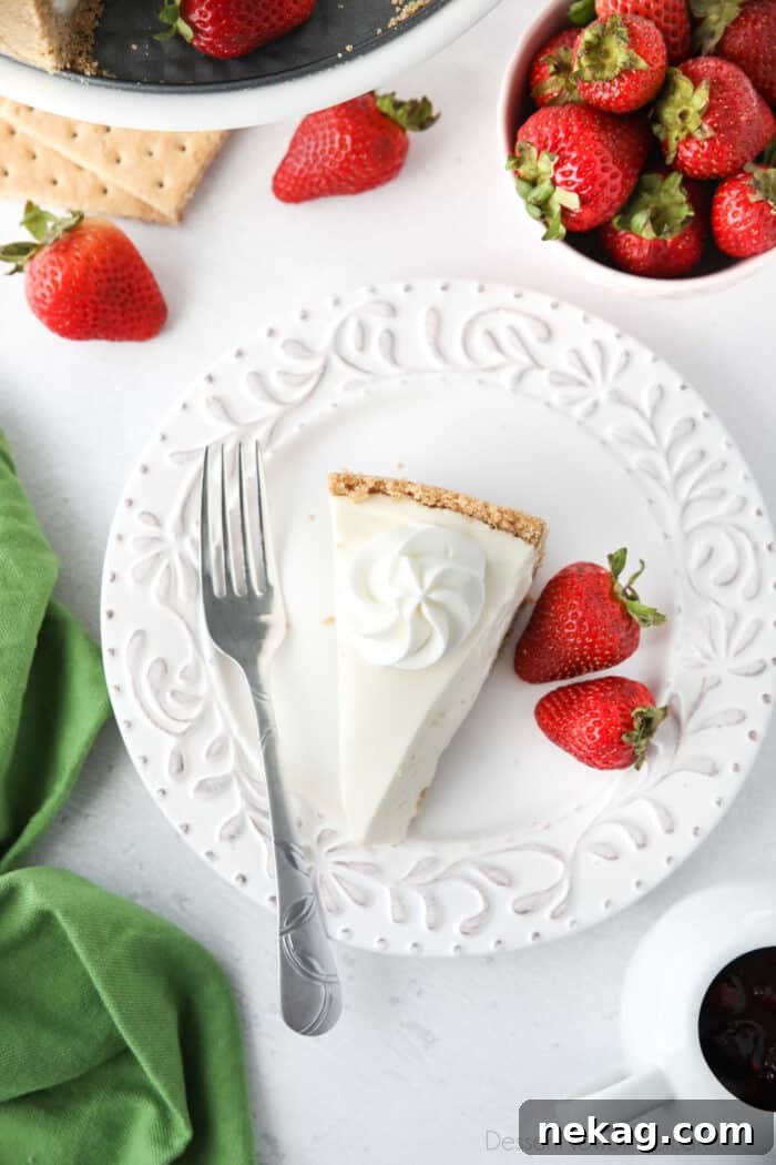 Oven-Free Cheesecake Delight 4 Slice of no bake cheesecake topped with a swirl of whipped cream.