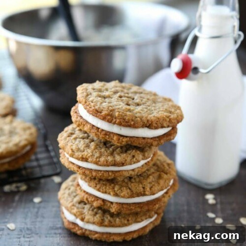 Oatmeal Cream Pies - Soft and chewy oatmeal cookies filled with vanilla buttercream frosting. Inspired by Little Debbie, but made fresh and delicious in your own home!