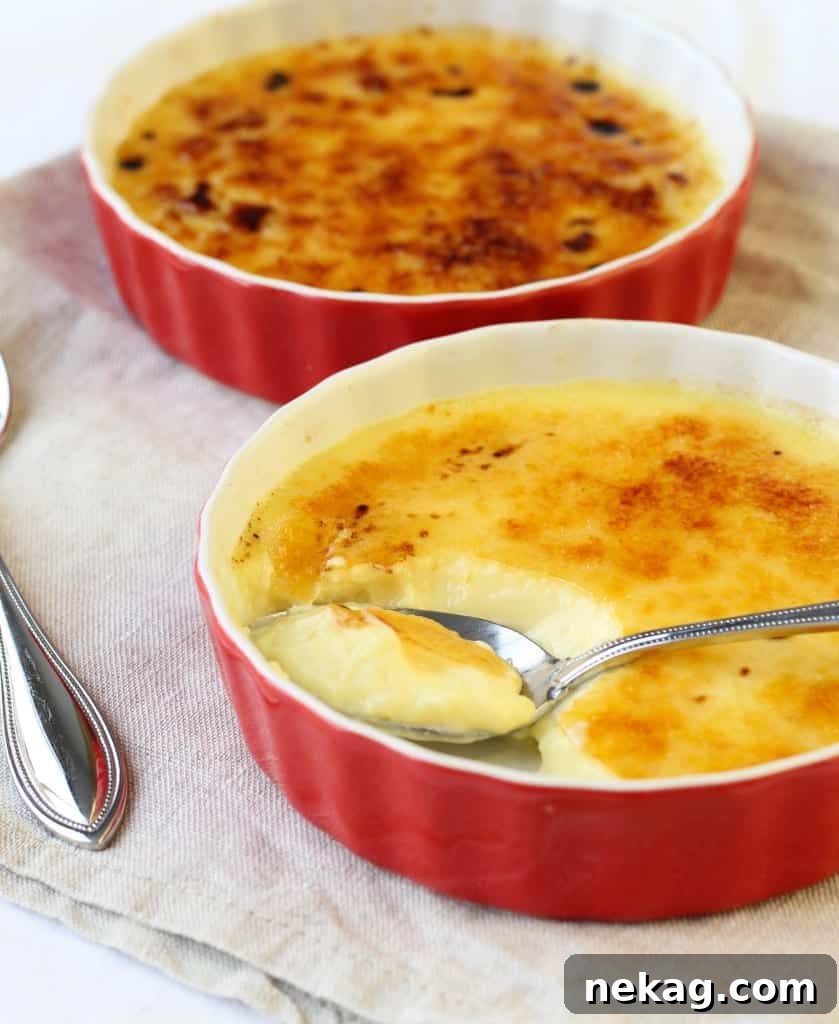 Close-up of a Crème Brûlée, showing the glossy, amber sugar crust.
