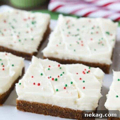 Gingerbread Cookie Bars with cream cheese frosting and holiday sprinkles.