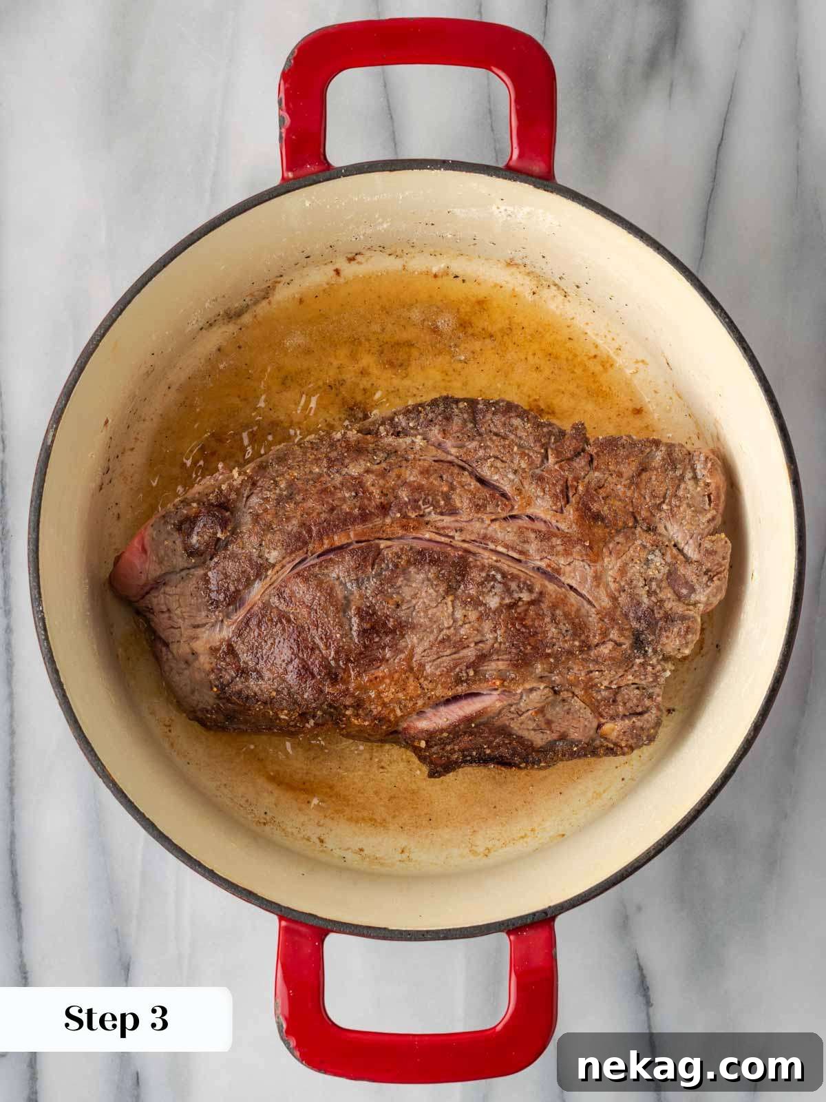 searing pot roast in hot Dutch oven with butter and olive oil.