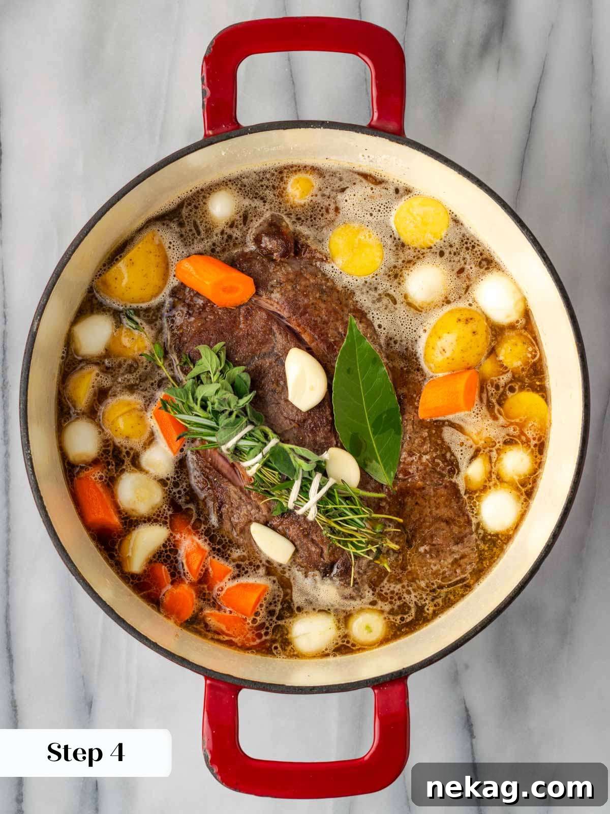 adding vegetables and stock to pot roast before covering and cooking.