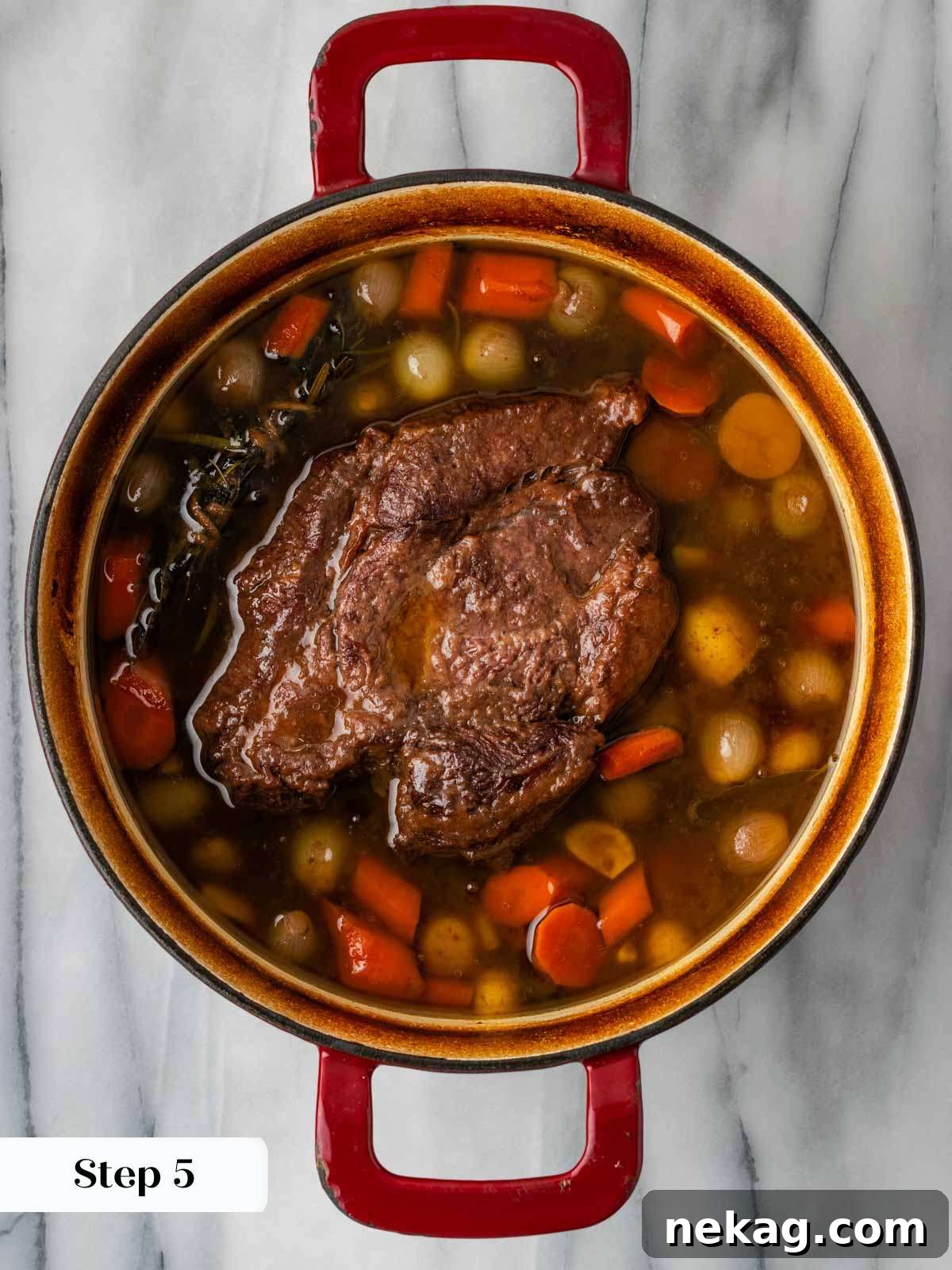 pot roast simmering gently in a covered Dutch oven.