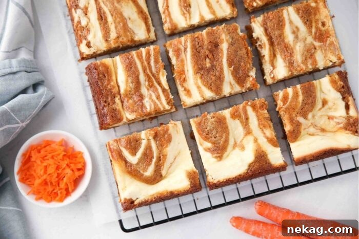 Decadent Carrot Cake Cheesecake Bars 13 Carrot Cake Brownies swirled with cream cheese, cut into squares.