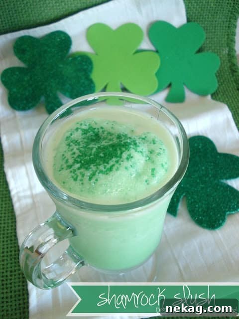 A close-up of a glass of Shamrock Slush, showing its smooth texture and vibrant green color.