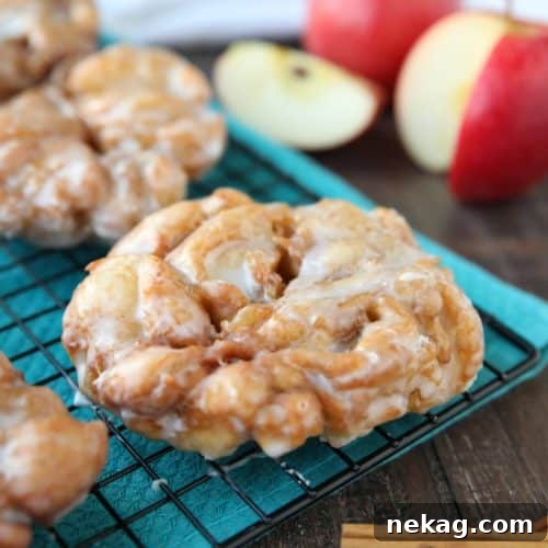 Apple Fritters - an easy and delicious yeast doughnut with chunks of apples, ground cinnamon, and a sweet glaze.