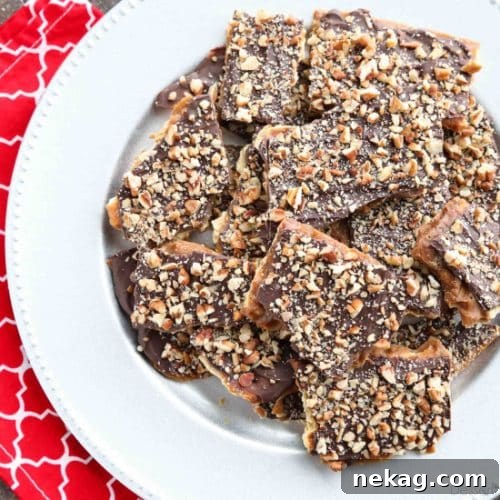Cracker Toffee (aka Christmas Crack) is so easy to make and highly addictive! Saltine crackers are coated in a quick toffee layer and topped with chocolate and nuts.