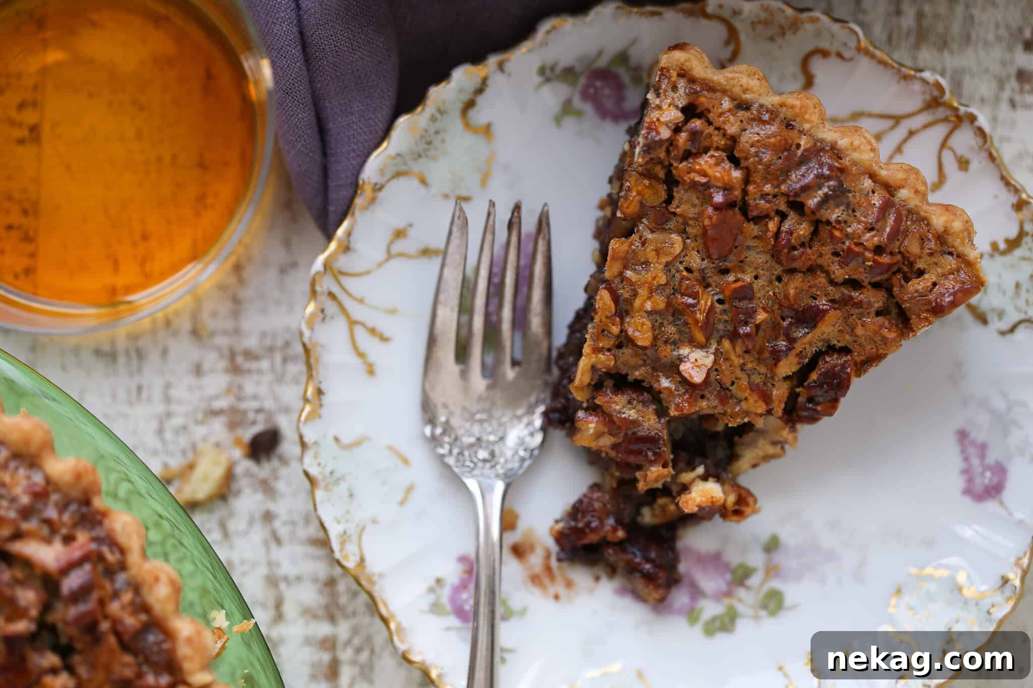 A slice of Southern Thanksgiving Pie on a white plate with a vintage fork, ready for a holiday feast.