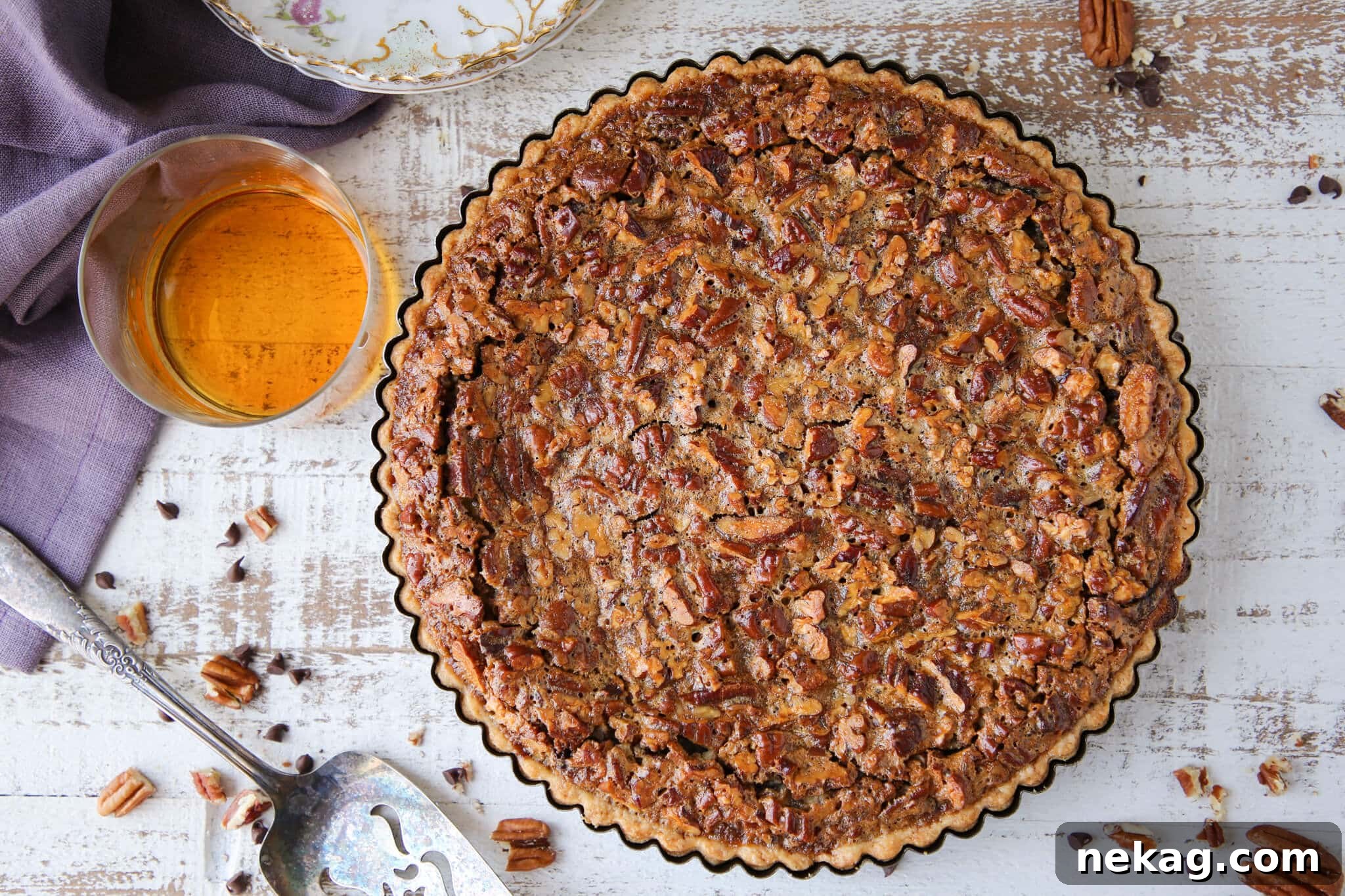 An unbaked Southern Thanksgiving Pie in a tart pan, ready for the oven.