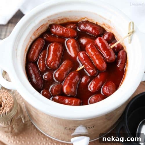 Crockpot Little Smokies is an easy appetizer for parties, the big game, or holidays. Only three ingredients and a slow cooker is all you need for these cocktail sausages. The sweet and tangy sauce is great on meatballs too!