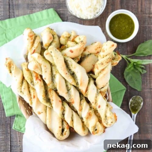 Herbaceous Pesto Twists 2 These easy Pesto Breadsticks are soft and flavorful with savory basil pesto and cheesy mozzarella twisted inside. A great appetizer or side for soup, salad, or pasta.