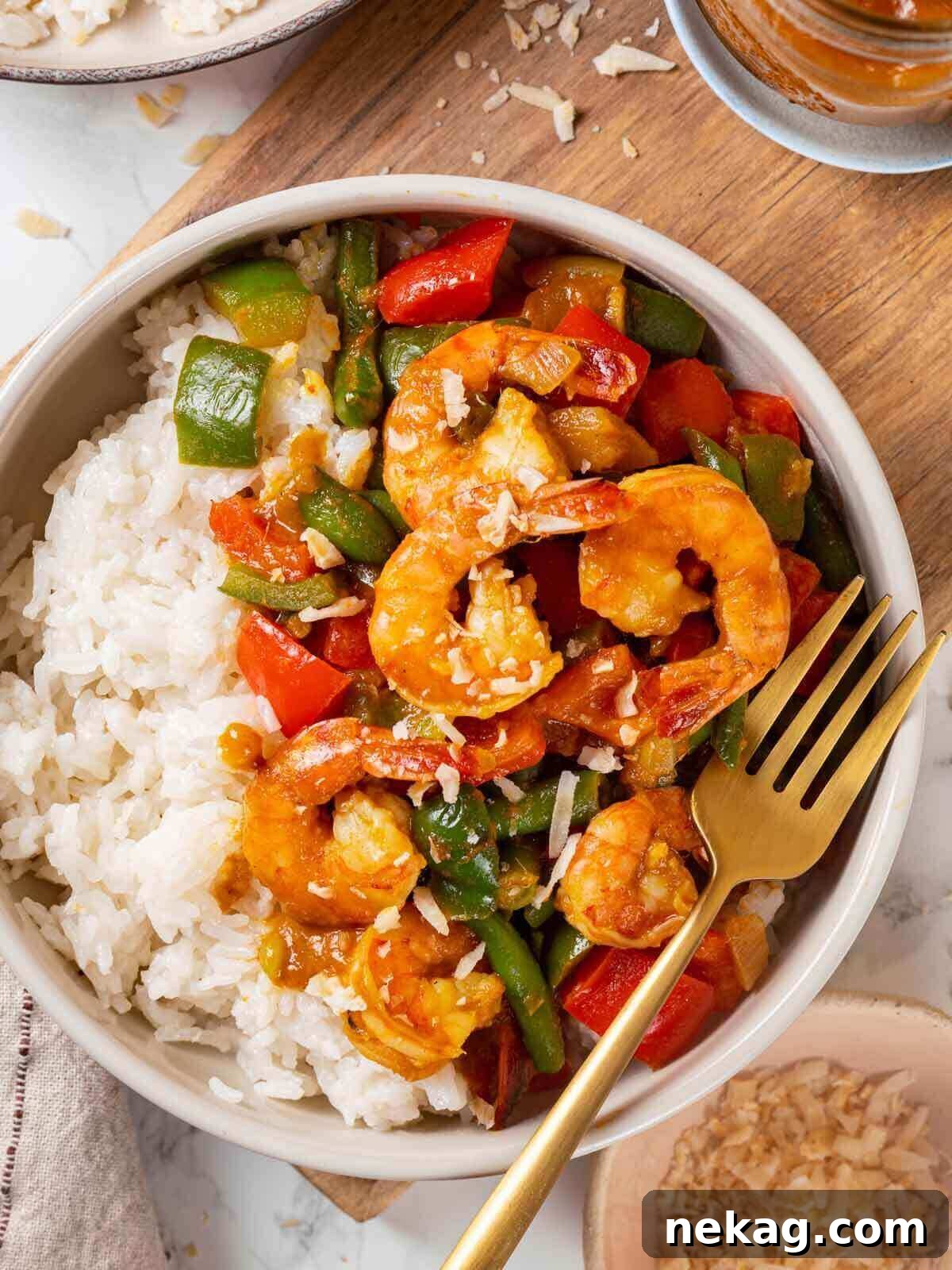 Flavorful shrimp curry served beautifully on a wooden table, ready to eat.