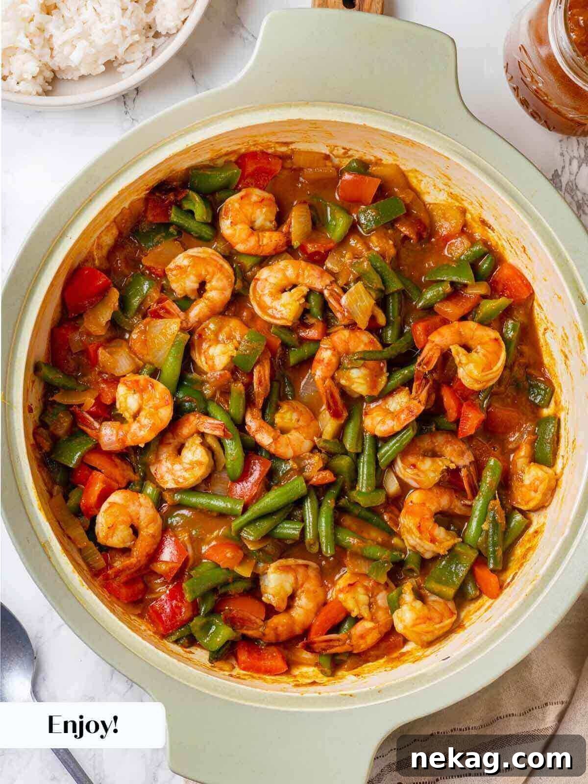 The fully prepared shrimp curry meal, beautifully presented and ready to serve.