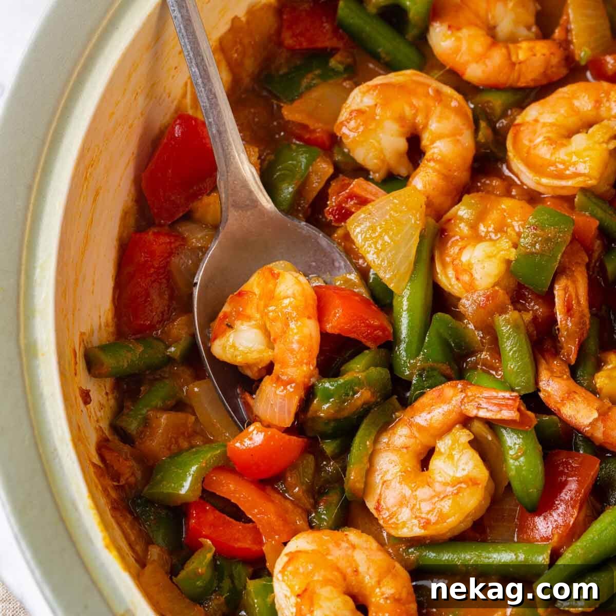 Perfectly cooked shrimp nestled in a rich, vibrant curry sauce.
