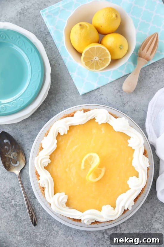 Lemon Cream Cheese Pie has layers of no-bake cheesecake and an easy microwave lemon curd inside of a vanilla wafer crust. It’s the perfect combination of sweet and tart. A great dessert for spring, Easter, or summer!