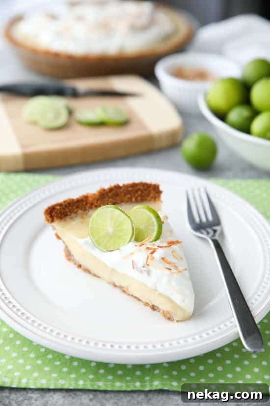 Coconut Key Lime Pie has coconut in the crust, cream of coconut in the key lime filling, and toasted coconut on top! A tropical dessert that's creamy, sweet, and tart.