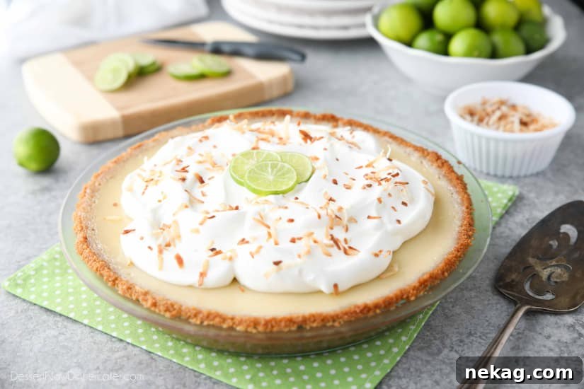 Coconut Key Lime Pie has coconut in the crust, cream of coconut in the key lime filling, and toasted coconut on top! A tropical dessert that's creamy, sweet, and tart.