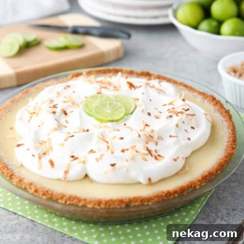 Coconut Key Lime Pie has coconut in the crust, cream of coconut in the key lime filling, and toasted coconut on top! A tropical dessert that's creamy, sweet, and tart.