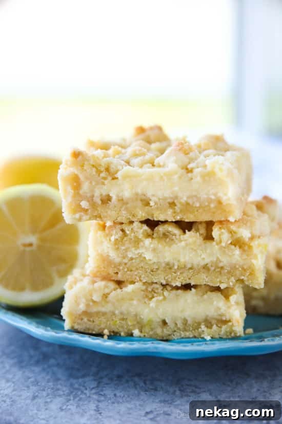 Freshly baked Lemon Crumb Bars cooling on a wire rack.