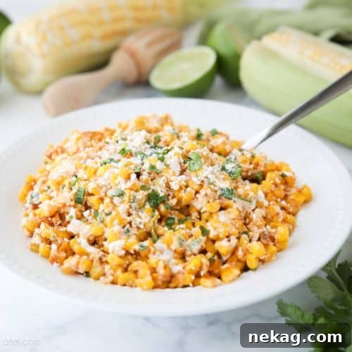 Mexican Street Corn Salad is easy, creamy, and packed with flavor! Your favorite roasted Mexican street corn (Elote) is cut off the cob (to make Esquites) and is served with a spoon, for a delicious summer side dish!