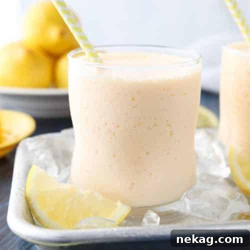 Close-up of a perfectly blended frosted lemonade in a glass, ready to be enjoyed.