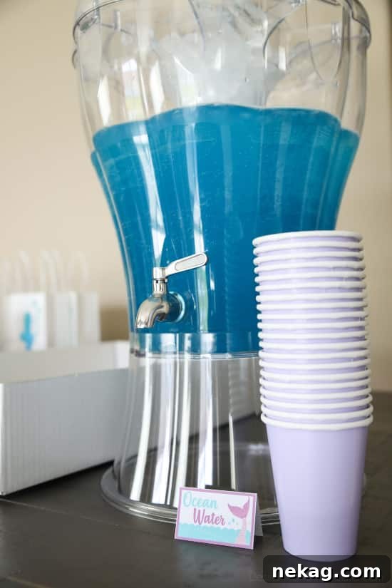 Magical Mermaid Tail Pull Apart Cupcakes 19 Mermaid party drink idea: 'Ocean Water' punch, a refreshing blue beverage.