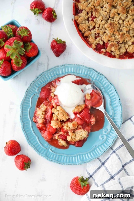 Strawberry Crisp (aka Strawberry Crumble) - Fresh, juicy strawberries are topped with a buttery brown sugar and oat crumb topping. Enjoy this summer dessert warm with a scoop of vanilla ice cream on top! 