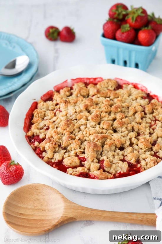 Strawberry Crisp (aka Strawberry Crumble) - Fresh, juicy strawberries are topped with a buttery brown sugar and oat crumb topping. Enjoy this summer dessert warm with a scoop of vanilla ice cream on top! 