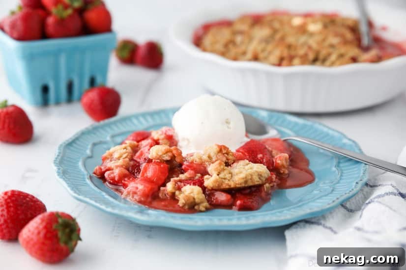 Strawberry Crisp (aka Strawberry Crumble) - Fresh, juicy strawberries are topped with a buttery brown sugar and oat crumb topping. Enjoy this summer dessert warm with a scoop of vanilla ice cream on top! 