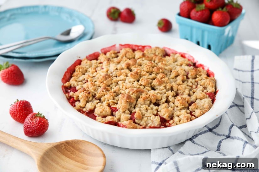 Strawberry Crisp (aka Strawberry Crumble) - Fresh, juicy strawberries are topped with a buttery brown sugar and oat crumb topping. Enjoy this summer dessert warm with a scoop of vanilla ice cream on top! 