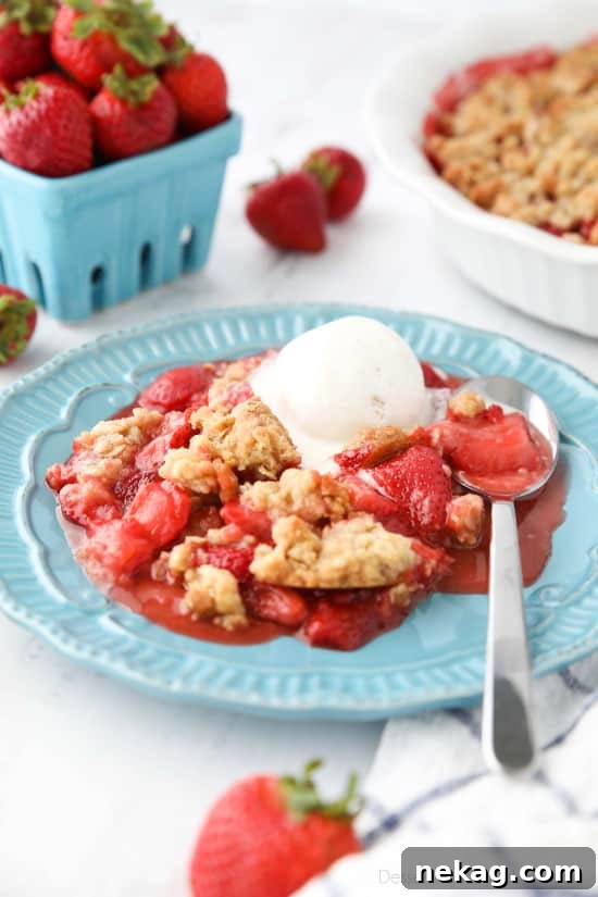 Strawberry Crisp (aka Strawberry Crumble) - Fresh, juicy strawberries are topped with a buttery brown sugar and oat crumb topping. Enjoy this summer dessert warm with a scoop of vanilla ice cream on top! 