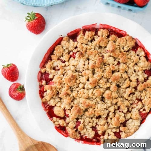 Strawberry Crisp (aka Strawberry Crumble) - Fresh, juicy strawberries are topped with a buttery brown sugar and oat crumb topping. Enjoy this summer dessert warm with a scoop of vanilla ice cream on top! ﻿