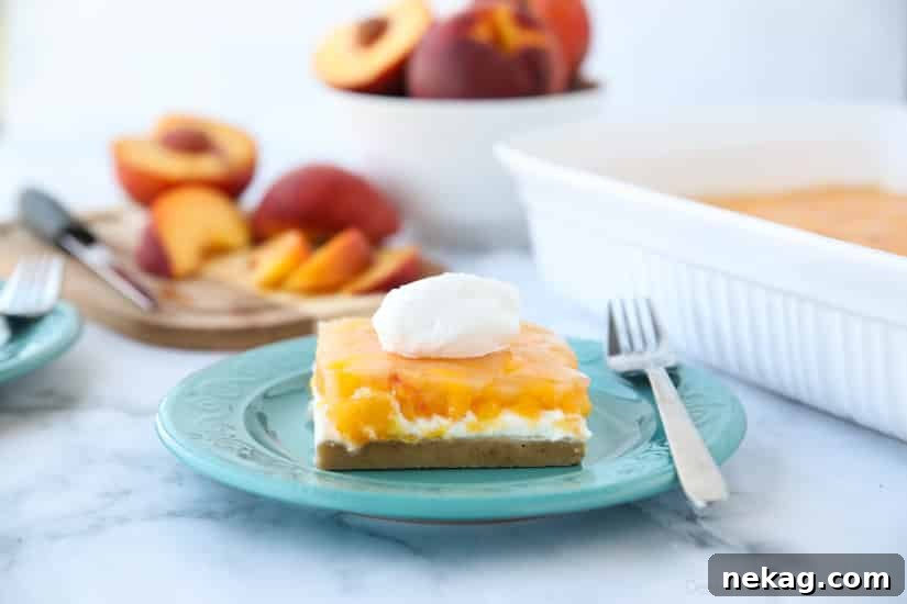 This Peaches and Cream Dessert has a pecan shortbread crust, no-bake cheesecake filling, and fresh peach layer on top. It's a delicious light and fruity summer dessert.