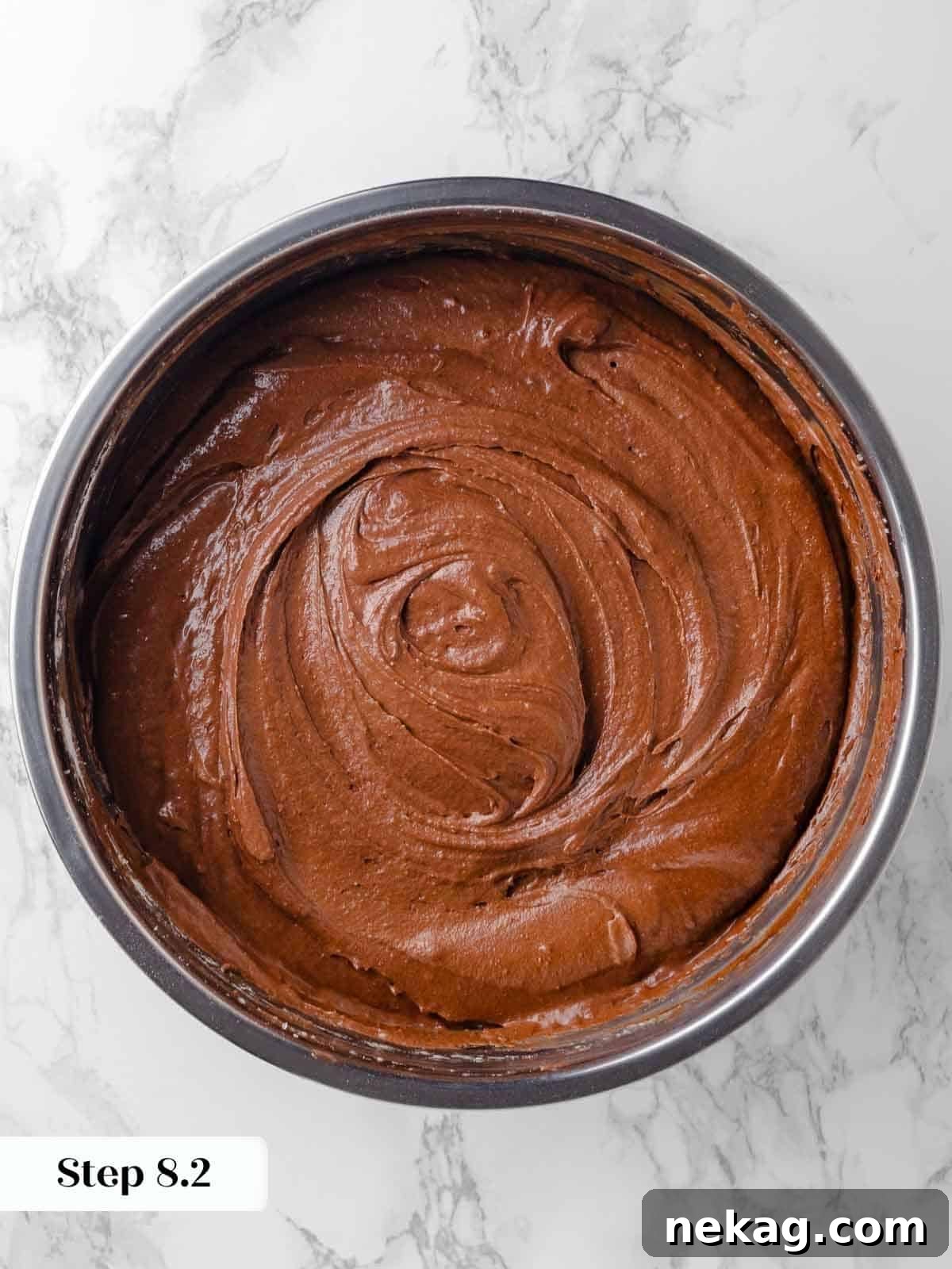 Thick, dark chocolate batter for the Guinness cupcakes, perfectly mixed and ready to be scooped into muffin liners.