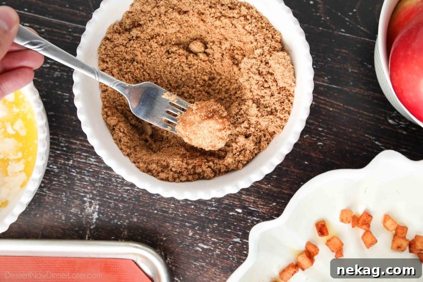 Apple Fritter Monkey Bread - Coating the dough pieces with cinnamon and brown sugar.