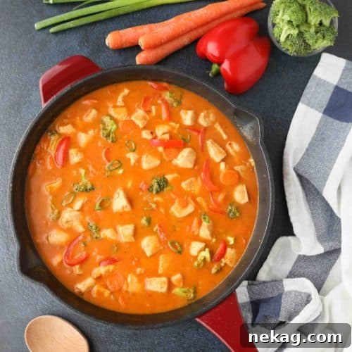 This Thai Red Curry with chicken and vegetables is easy, flavorful, and dinner ready in 30 minutes or less. It's healthier than takeout, and easy to make spicy or mild.